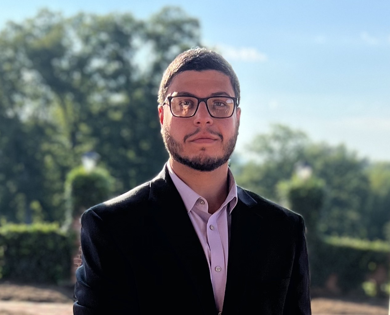 Portrait of Bassem Saleh in a blazer outdoors